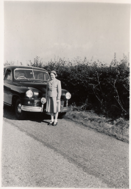 Christine Edge standing in front of Dads Standard Vangard car KNB 731